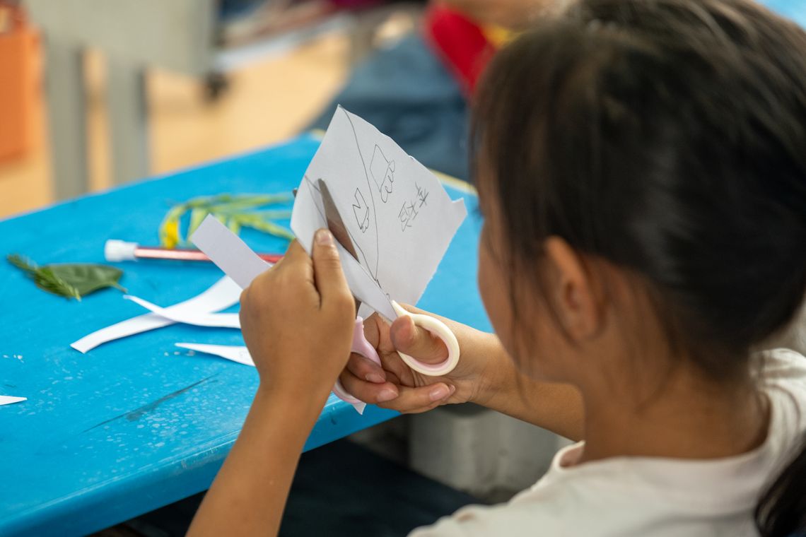 child cutting paper cyanotype workshop 01